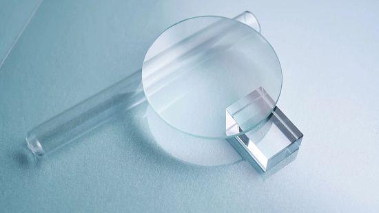 Glass objects and prisms on a blue background